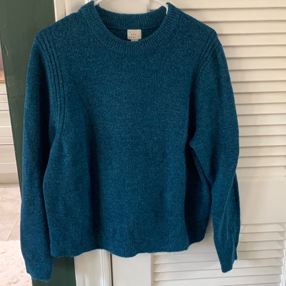 A new day sweater